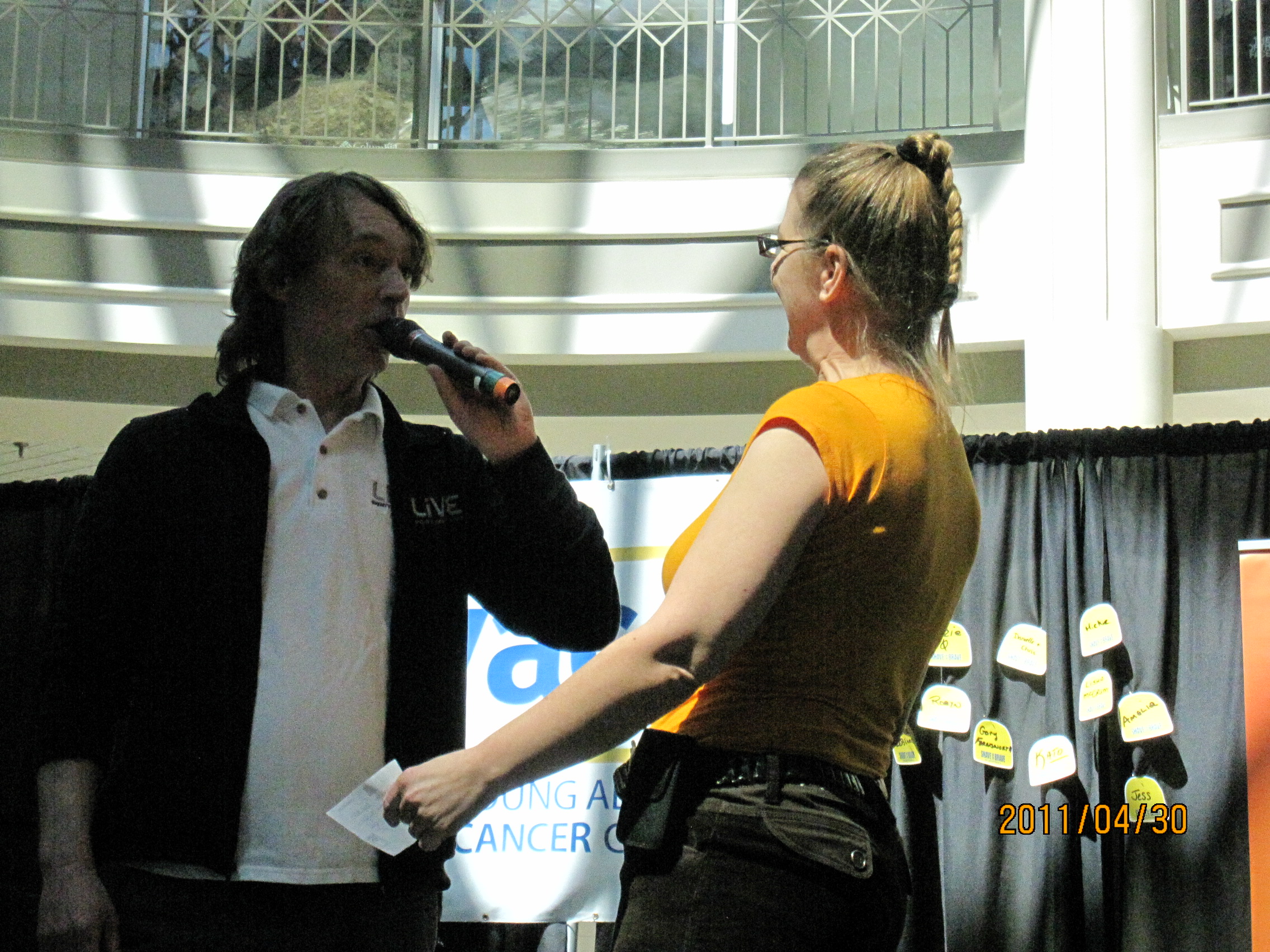 A man interviewing a woman before her shave
