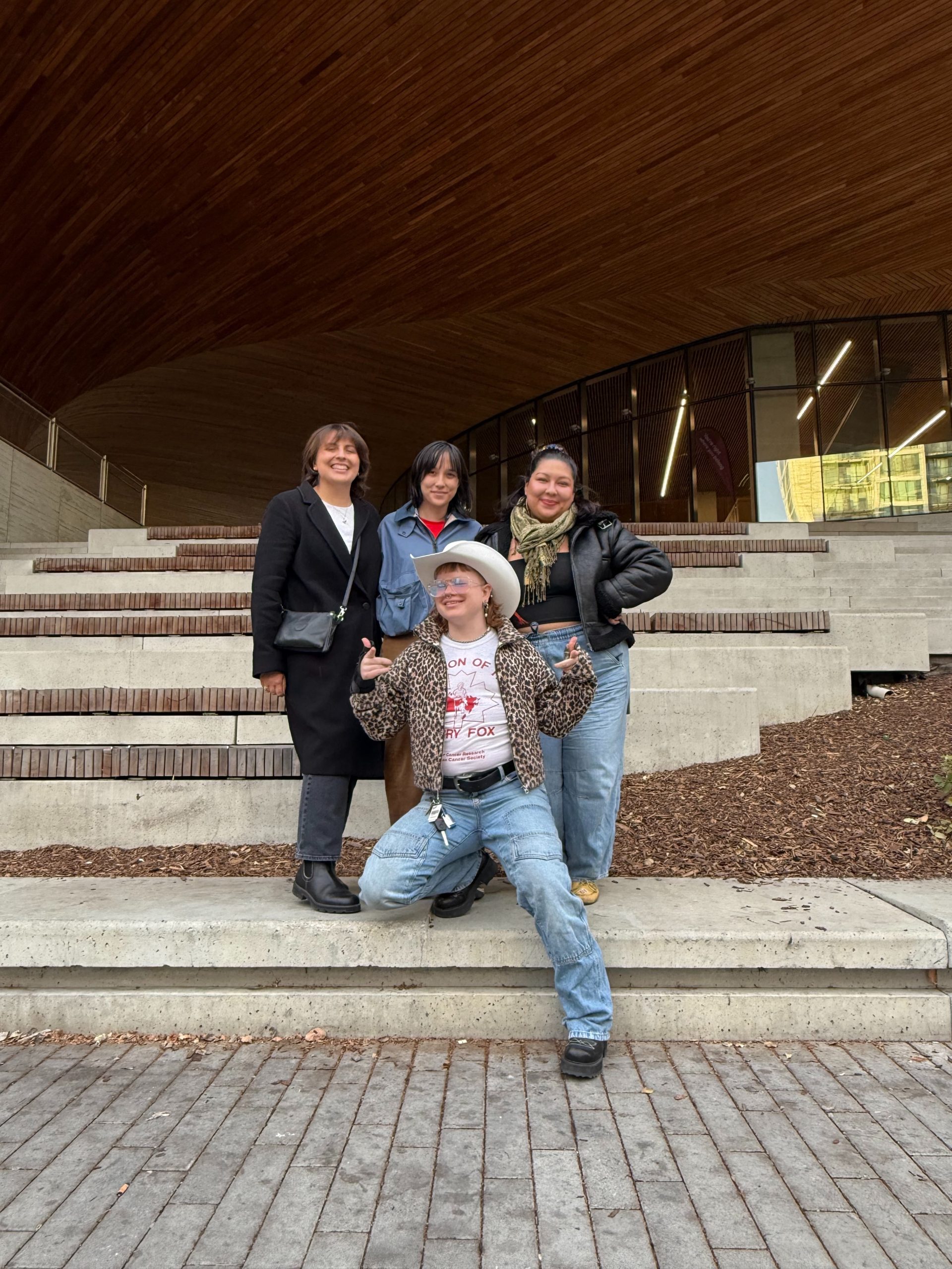 Dani and three friends pose in a group shot during an outing.
